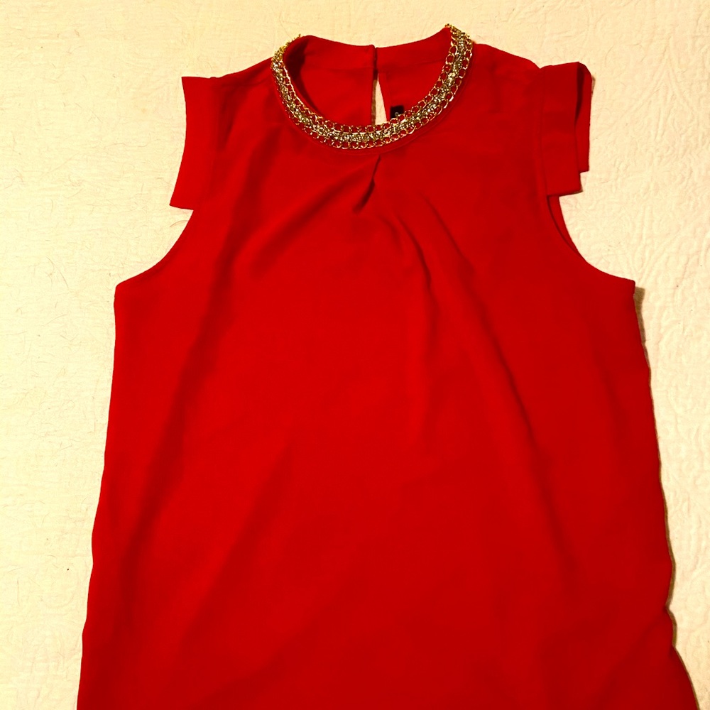 Red sleeveless blouse
